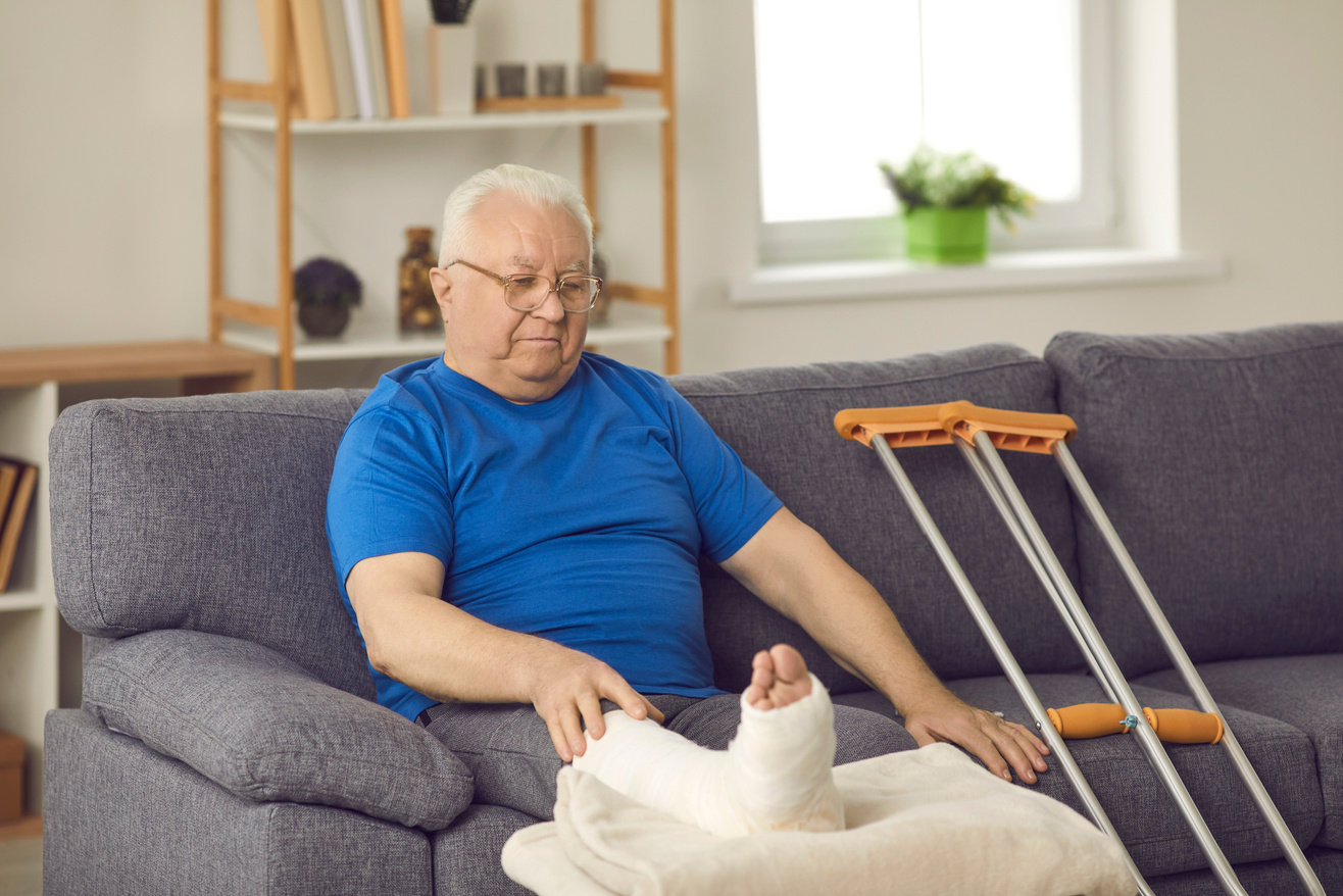 Senior Man with Broken Leg Stays at Home and Waits for His Bone Fracture to Heal